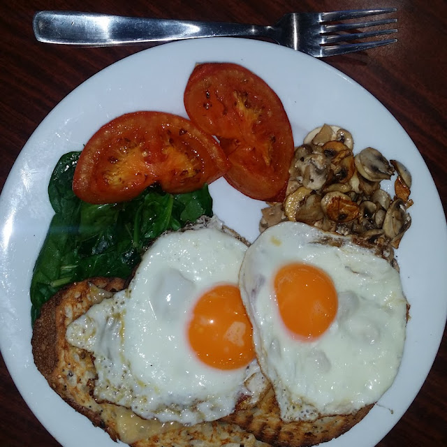 Fried Eggs with Mushrooms and Grilled Tomatoes on Linseeds Toast
